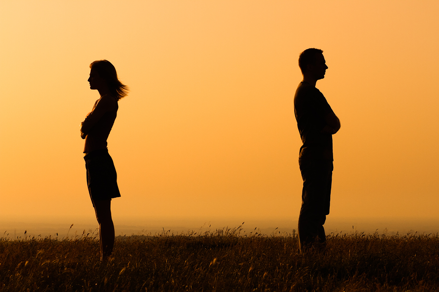 Relationship difficulties Silhouette of a angry woman and man on each other.
