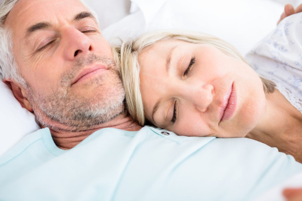 http://www.dreamstime.com/stock-images-loving-mature-couple-sleeping-bed-closeup-home-image37814304