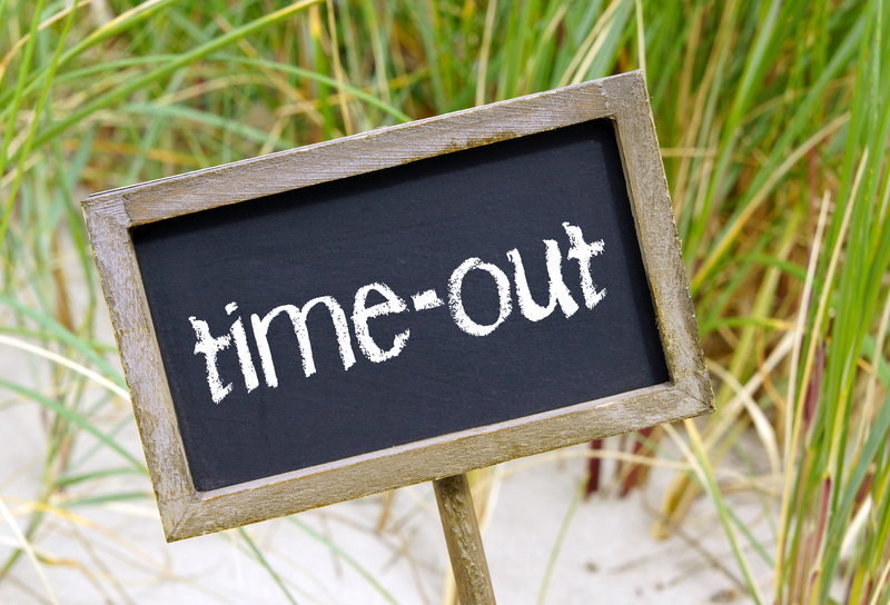 http://www.dreamstime.com/royalty-free-stock-photography-time-out-sign-beach-grass-background-summer-holidays-concept-image34679227