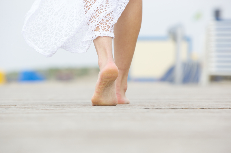 http://www.dreamstime.com/stock-images-low-angle-barefoot-woman-walking-away-close-up-image40472414
