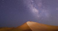 Night sky over sand dunes